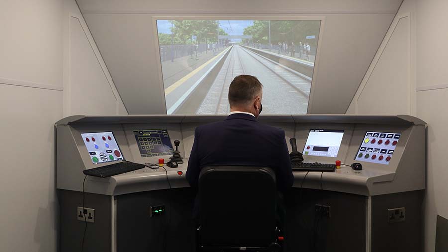 Man using a train cab simulator