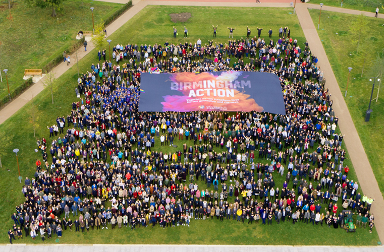 Aerial photo of large group of people in University of Birmingham's Green Heart