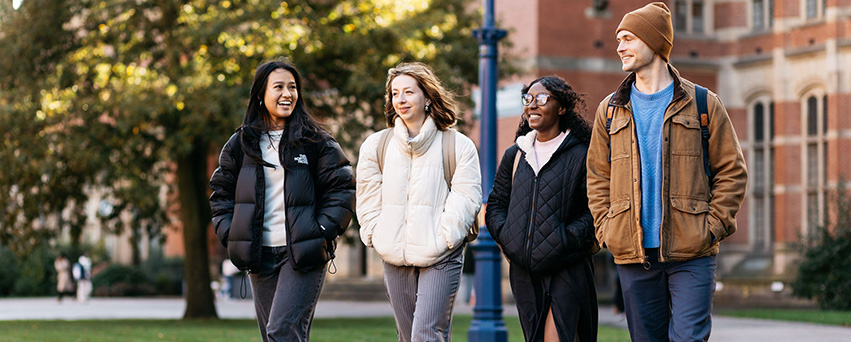 Four students walking and talking