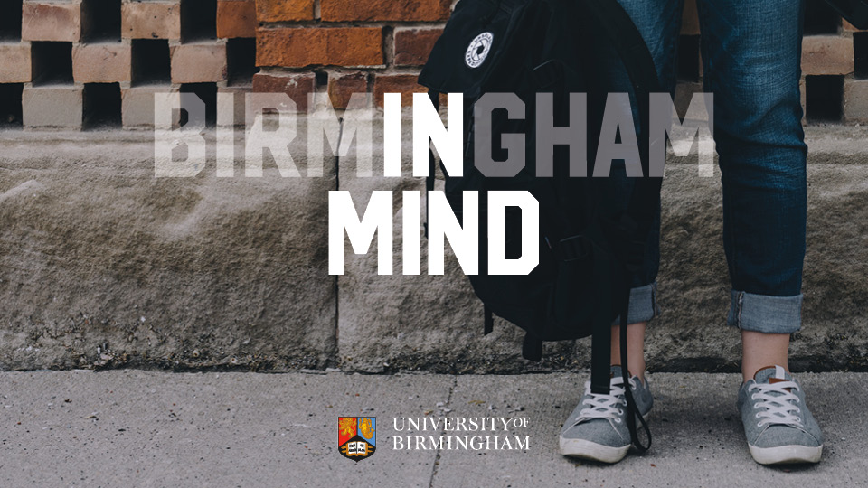 Young person in jeans with rucksack, seen from knees down, with the words Birmingham In Mind