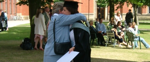 Mother and daughter hug after graduation