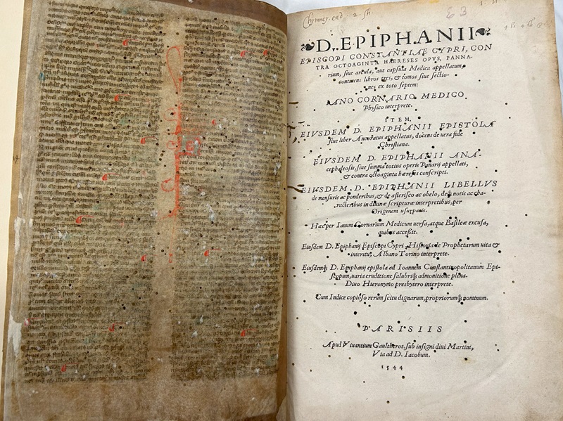 Epiphanius, from 1544. The title page is written in Latin, and the facing page is a leaf reused from a hand-written Mediaeval manuscript.