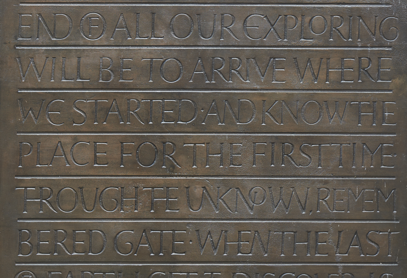 Detail of carved bronze Pump Room Door by Betina Furnee featuring inscription of poetry by T.S Eliot