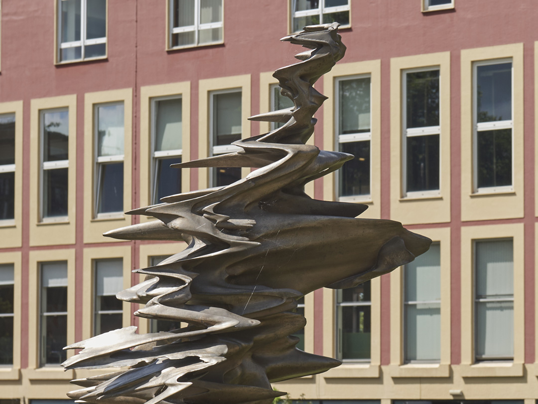 Close crop of bronze sculpture Father Sky/Uranus by Zachary Eastwood-Bloom from side showing abstract pointed shapes angle