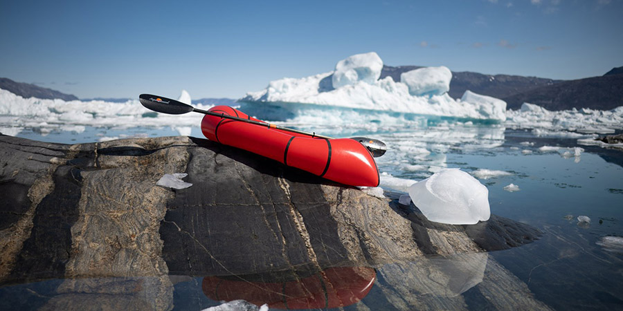 A kayak near ice bergs