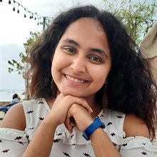 anwesha sitting outside at table