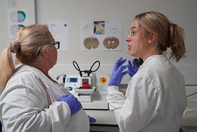 Two women talking in the lab