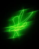 A green lazer against a black background