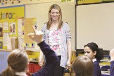 Teacher in classroom with young kids