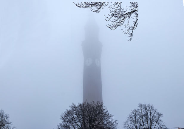 The University of Birmingham clock tower, Old Joe is barely visible through thick fog.