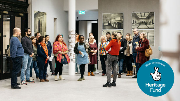 A history experts delivers a heritage tour to a group of Exchange visitors.