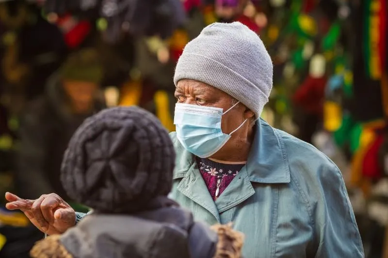 Elderly black woman wearing face mask