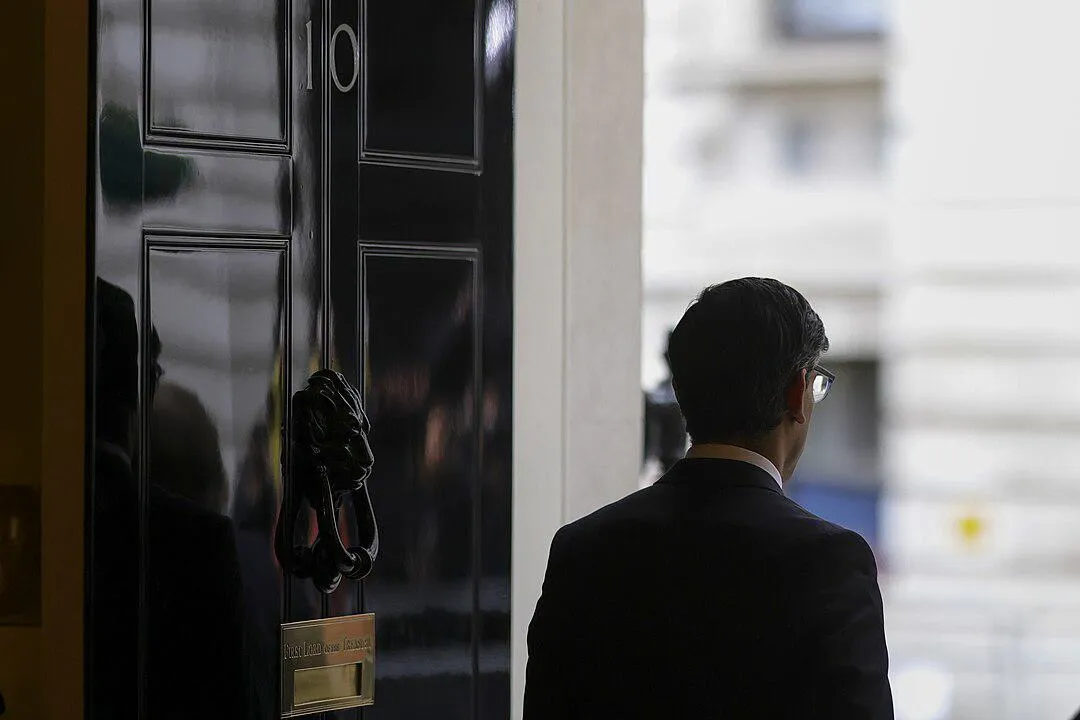 Rishi Sunak heading out the door of number 10 Downing Street