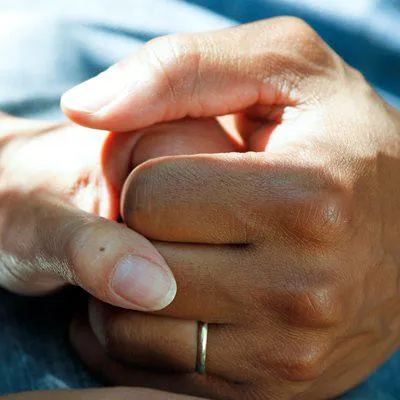 Patient and doctor holding hands