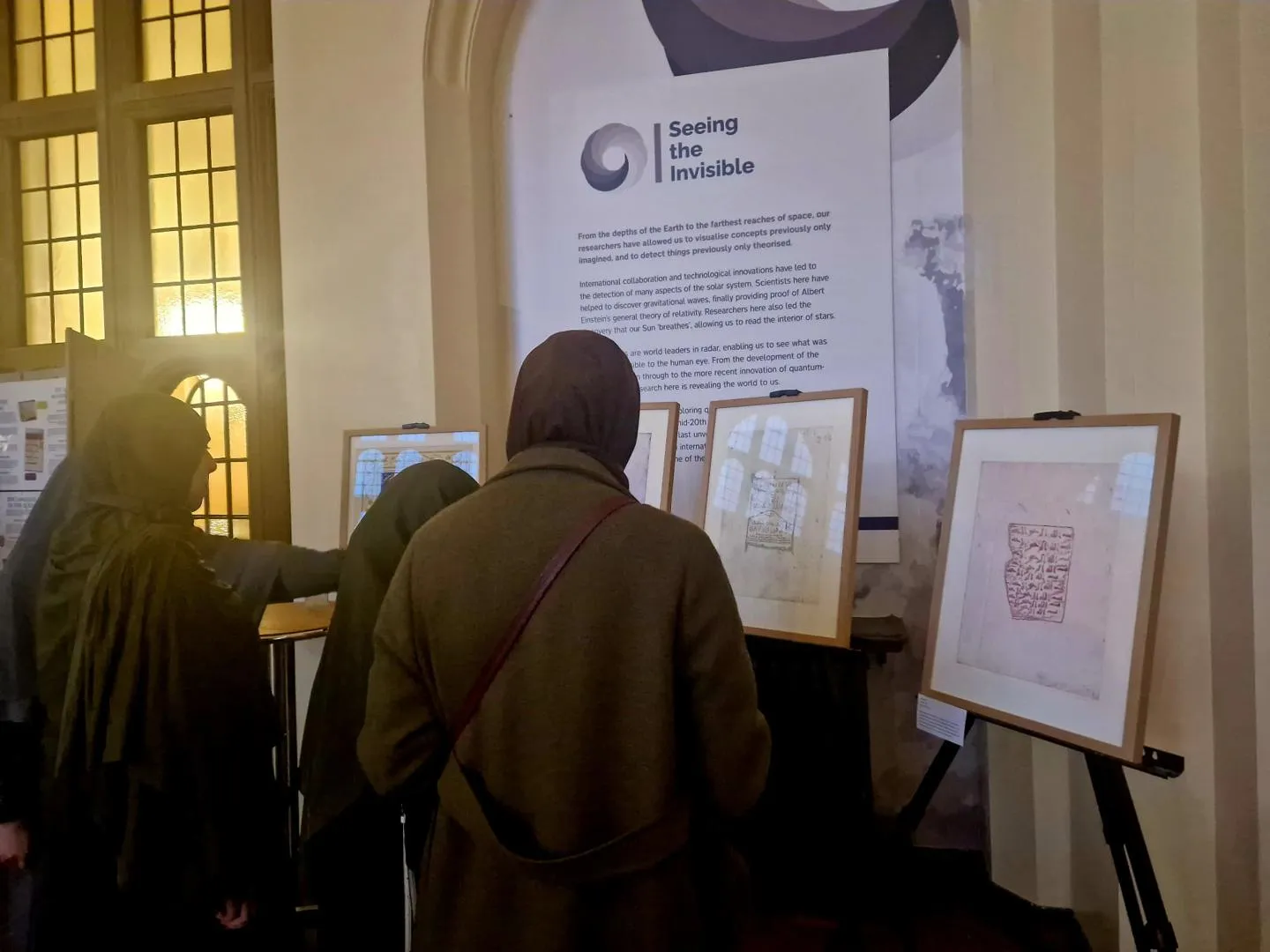 Guests viewing Taiba and Haseebah’s prints