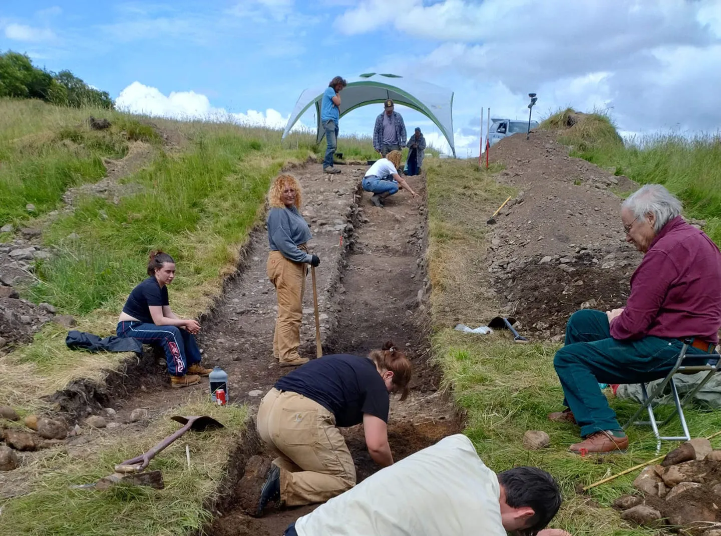 A group of archaeologists at a dig site