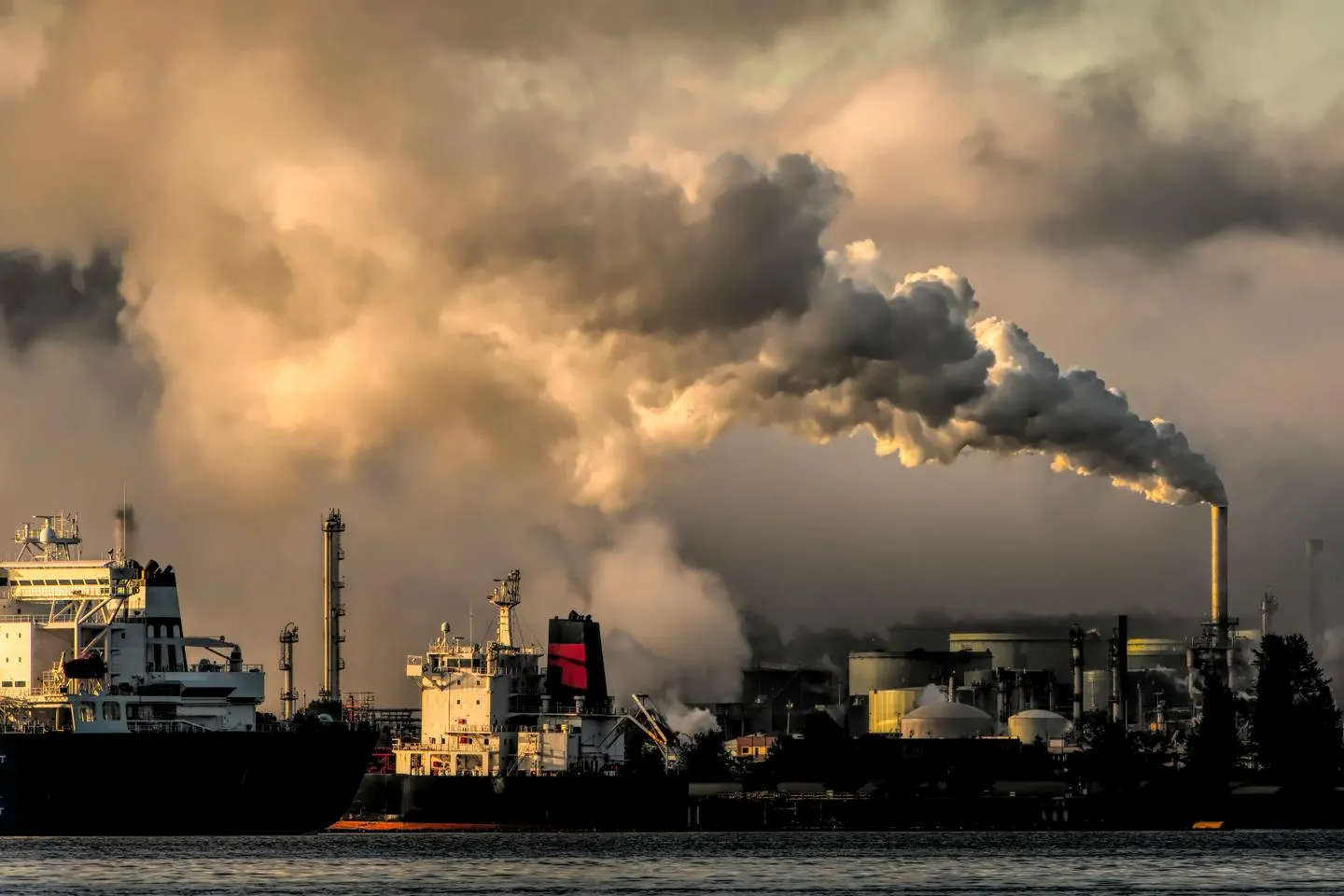 Port with energy plant giving off fumes.