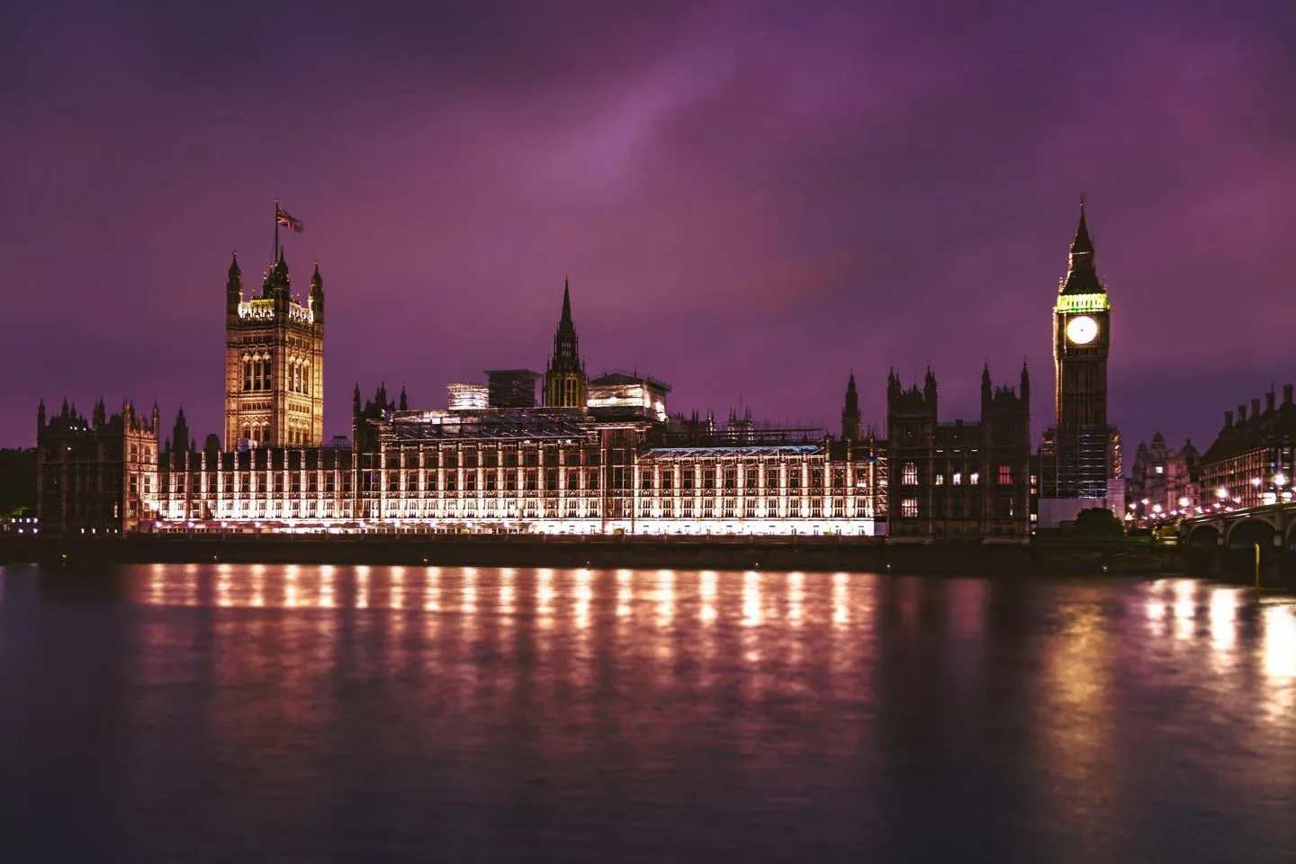 Exterior of the Houses of Parliament in London at night. 