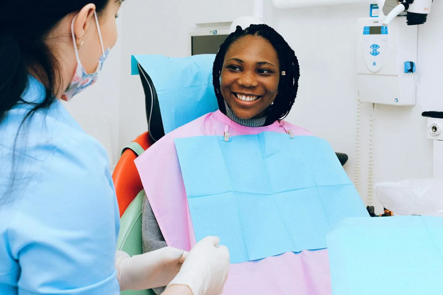 Dental professional and a female patient in a dental practice