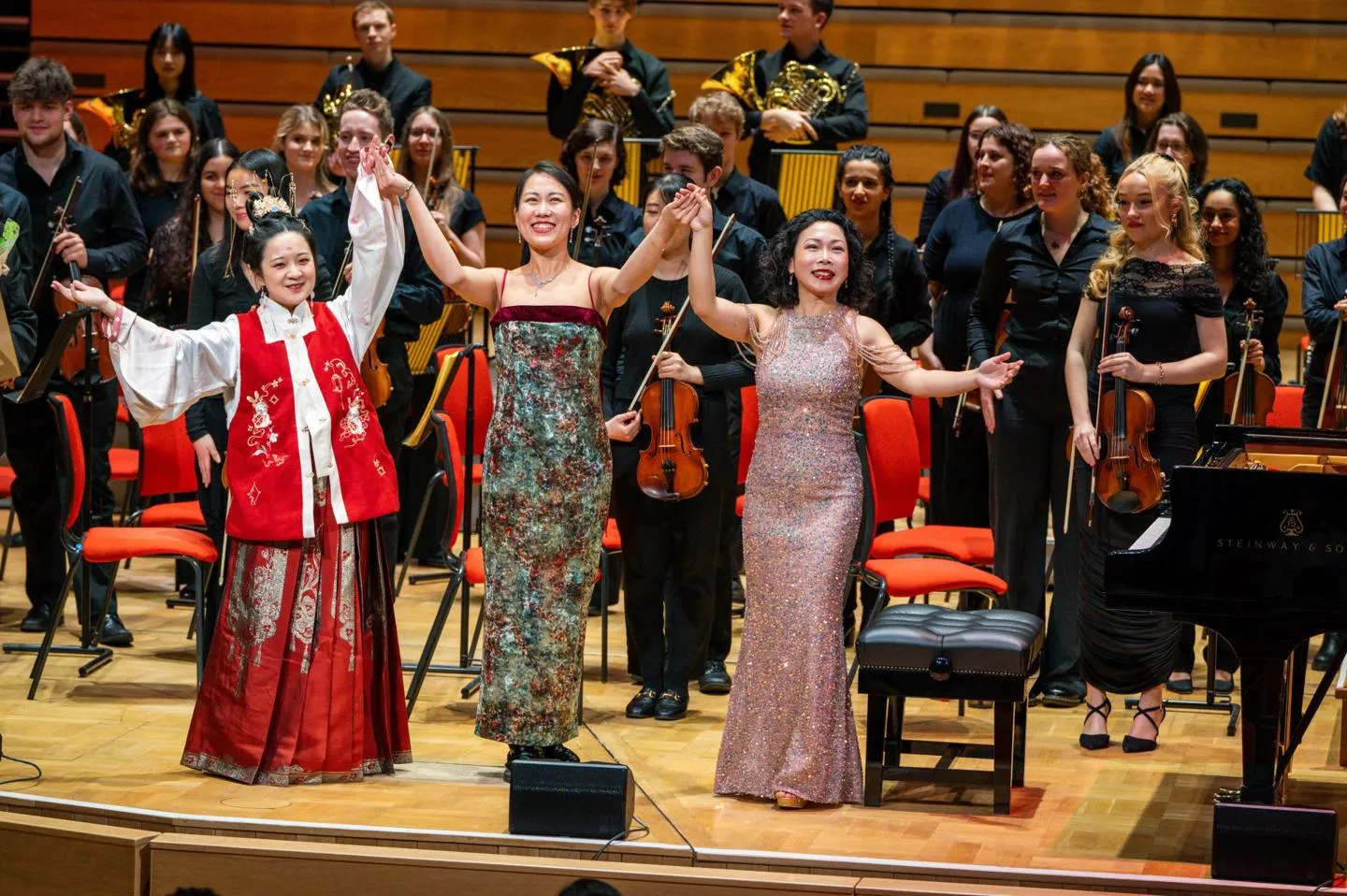 Three chinese musicians take a bow