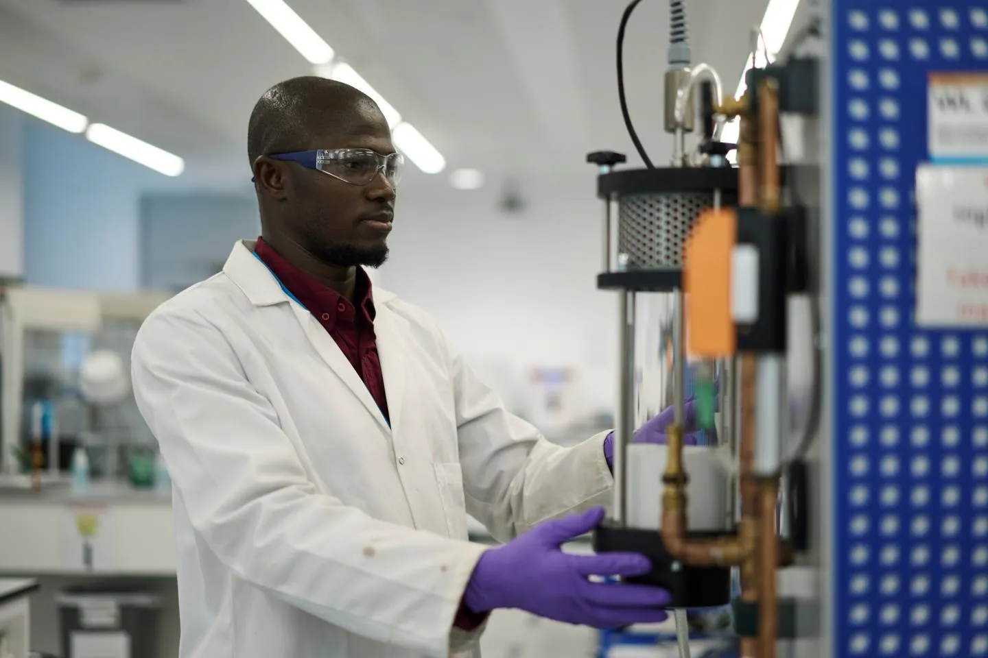 Researcher operating lab equipment