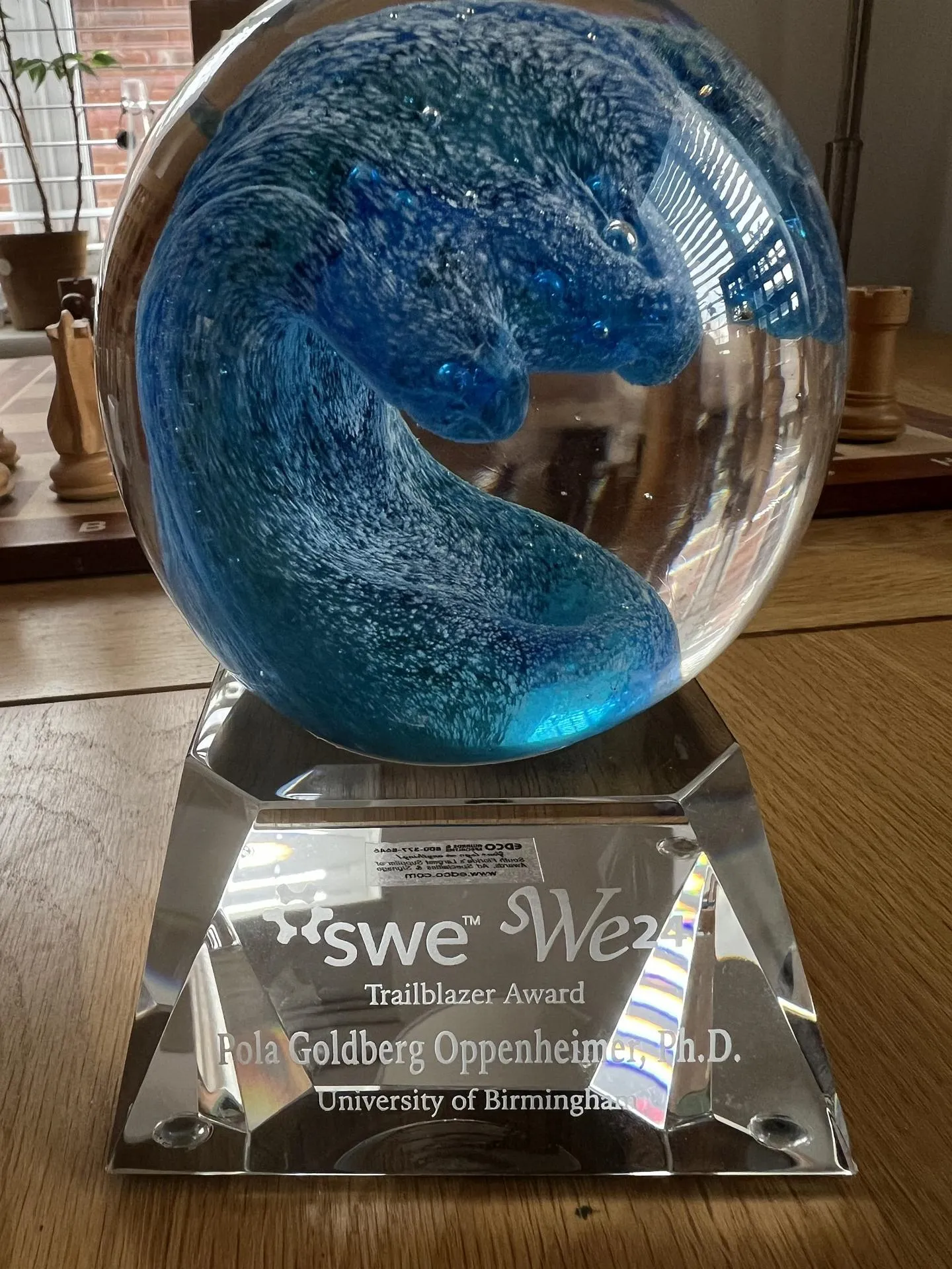 SWE 2024 Trailblazer award. A glass sphere on top of a glass stand engraved with Pola Goldberg Oppenheimer, PhD, University of Birmingham