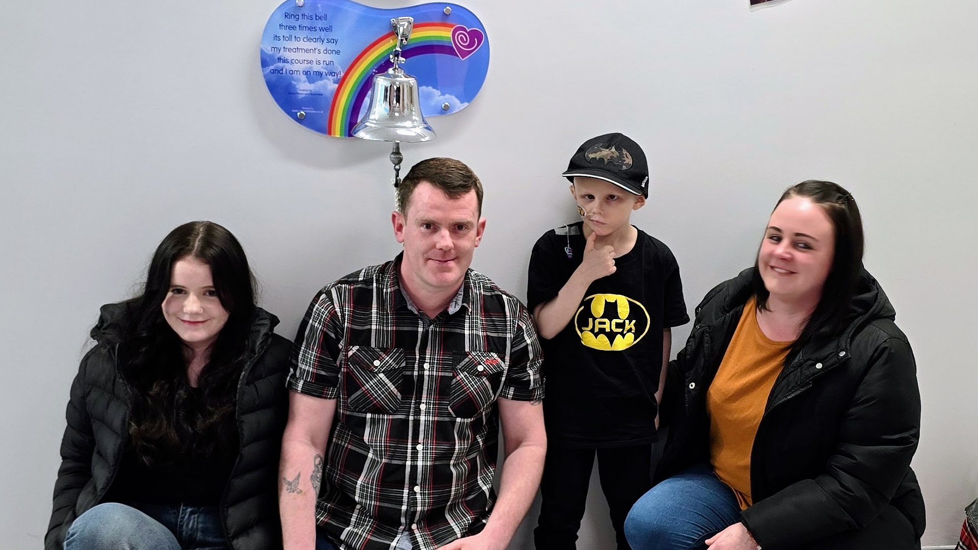 Jack Bourne and family ringing cancer treatment bell at Birmingham Children's Hospital
