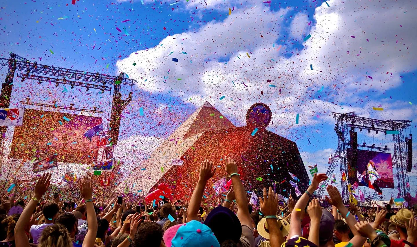 The Pyramid Stage at Glastonbury with confetti in the air and a rapturous crowd