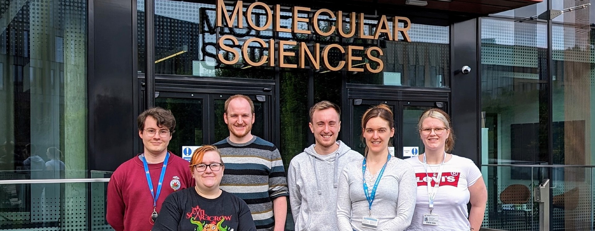 Andrew Jupp with lab  colleagues outside the Molecular Sciences building