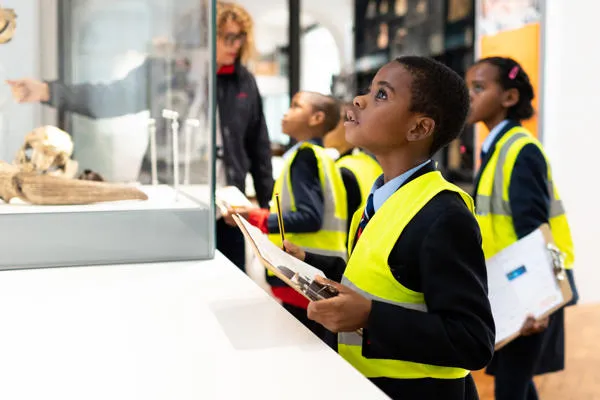 Pupils examine the Ice Age display.