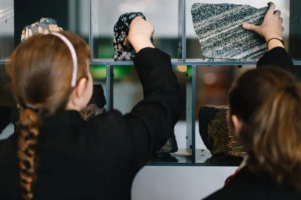 Students examine the Rock Wall.