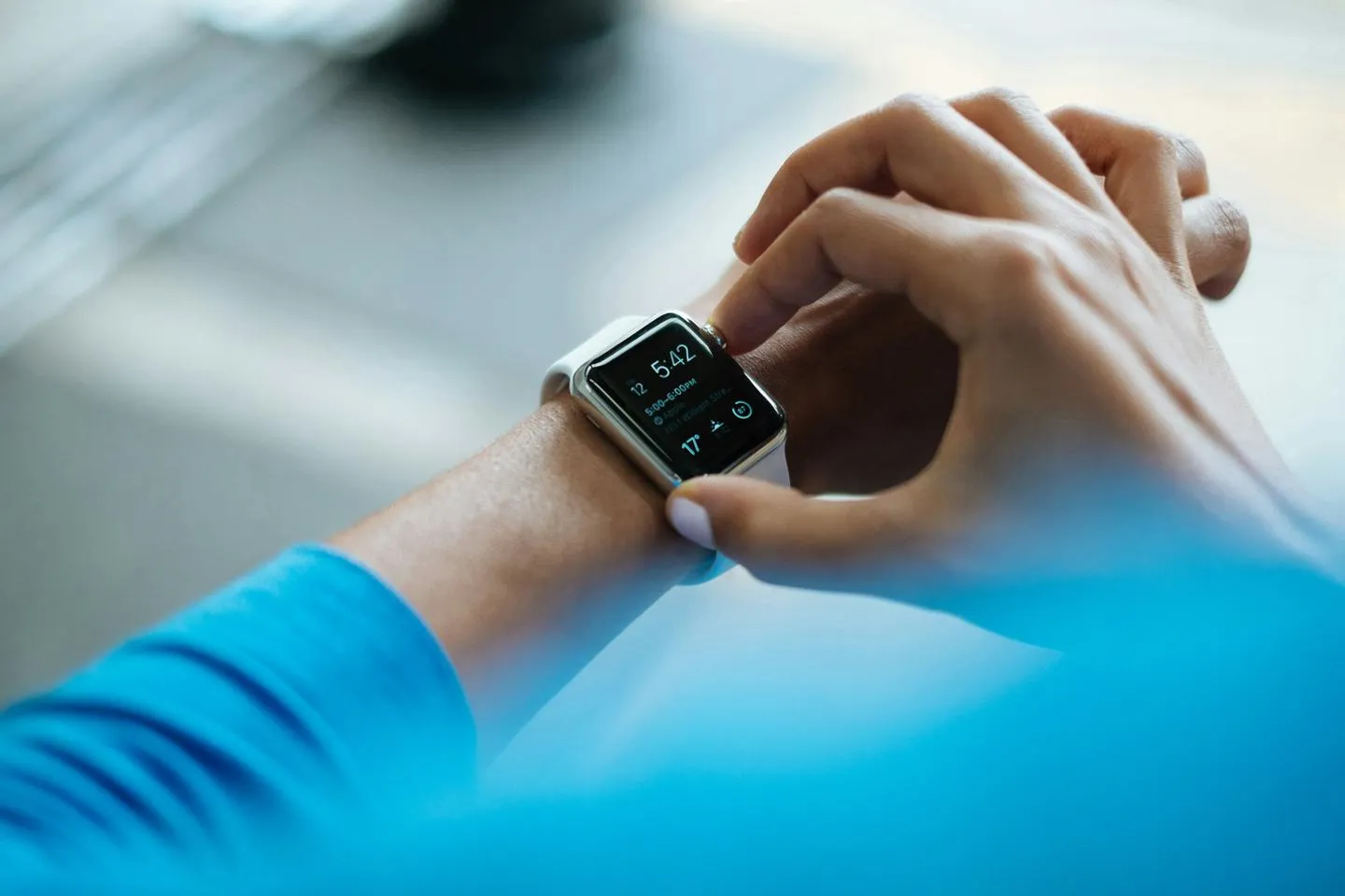 Man adjusts Apple watch