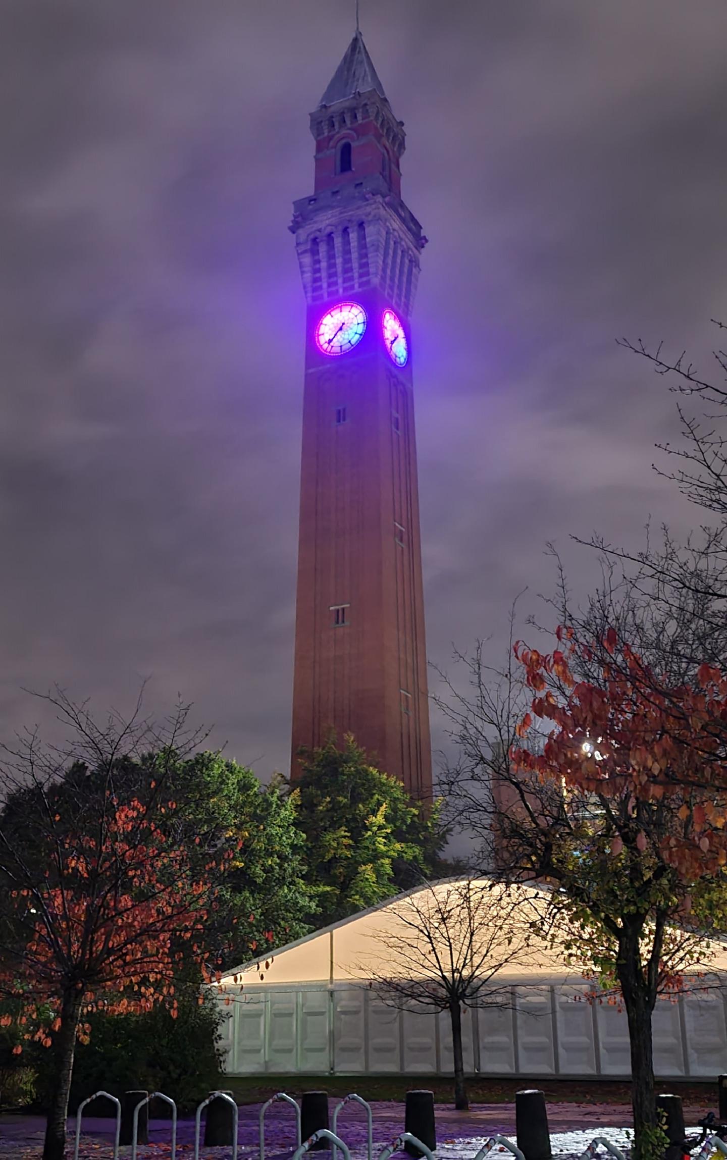 Old Joe lit up in pink and blue