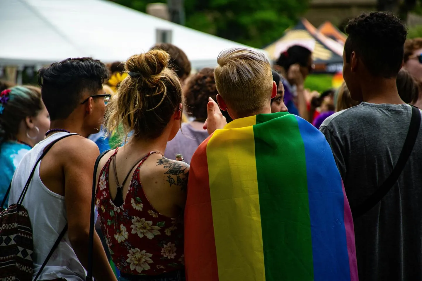 People at Pride event facing away from the camera.