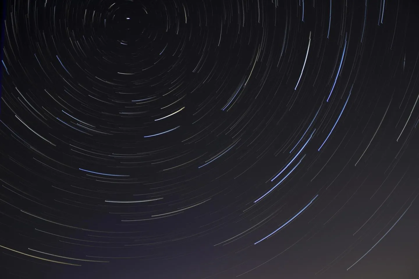 Time lapse of stars in night sky.