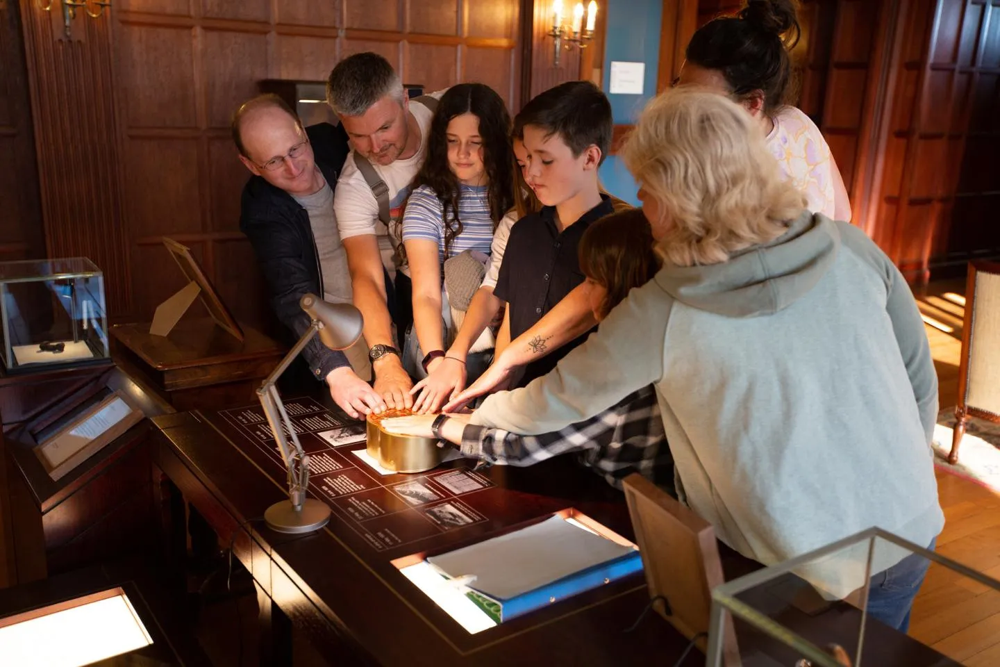 A family playing the Riddlequest escape game.