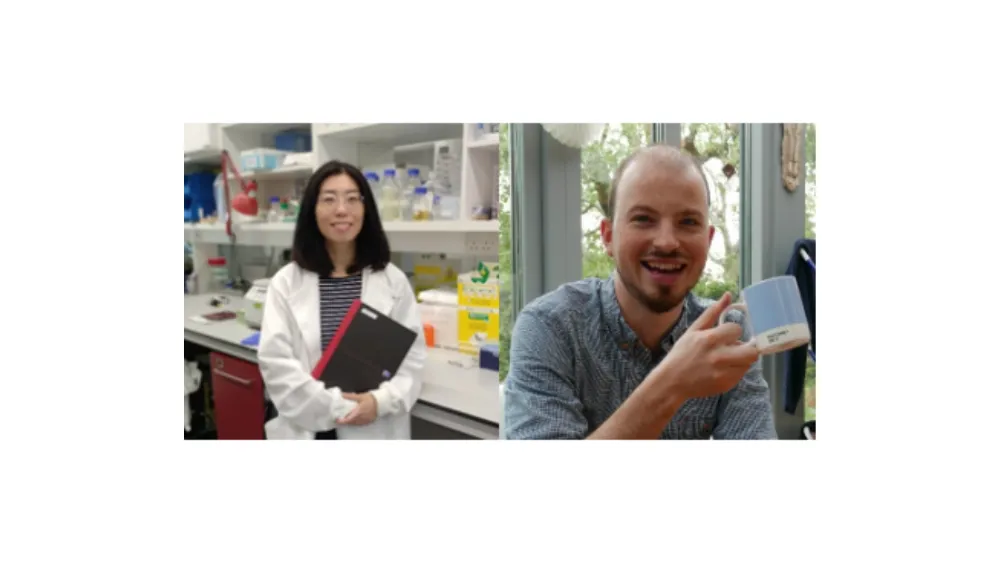 Dr Zhang in a lab wearing a white lab coat. Dr Wragg wearing a blue jumper holding a mug. 