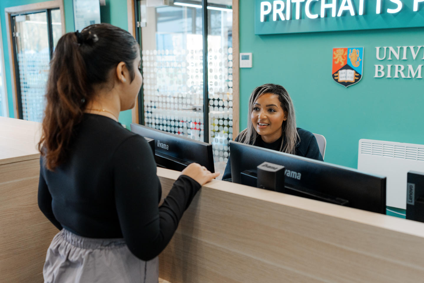 Student talking to receptionist