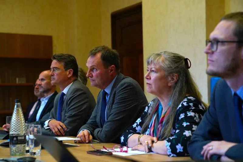 University of Birmingham senior staff listen to their counterparts from Ivan Franko National University during a virtual meeting.